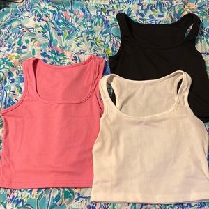 THREE CROPPED TANK TOPS SIZE SMALL!! Pink, black, and white.